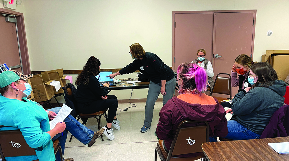 Nursing students talk with clients in Pine Ridge Nursing students talk with clients in Pine Ridge